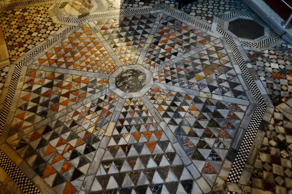 Part of the inlaid marble floor: a star of coloured stone triangles