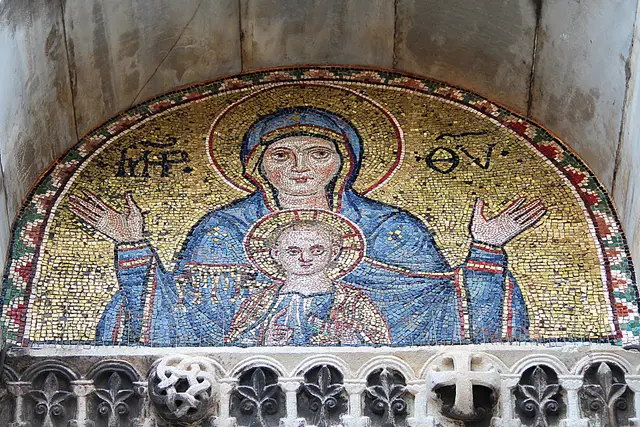 A mosaic lunette of the Virgin and Child, her hands raised in prayer