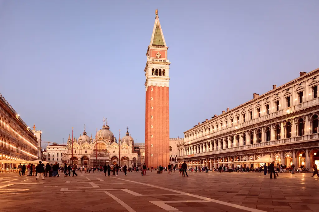 Piazza San Marco at dusk, with the Campanile and the Basilica at the far end