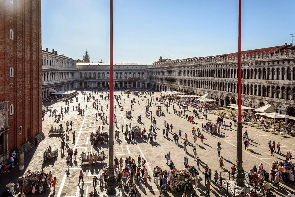Piazza San Marco seen from the Basilica’s terrace, between the flagpoles, with the Procuratie on both sides